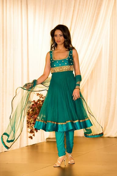 Woman in a teal Anarkali suit